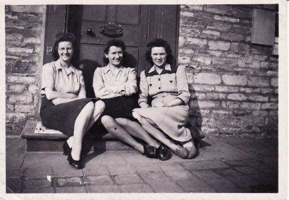 Lilla (wife of Herbert James Baxter), Kitty May Baxter and Rene (wife of George Baxter) sitting on the doorstep of George and Rene's house on The Green, Chelveston

(Image by Christine Chambers, daughter of Kitty)