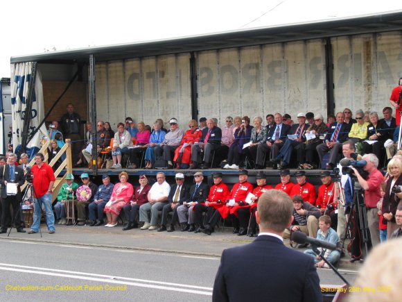 US Veterans and families on the trailer opposite the memorial site