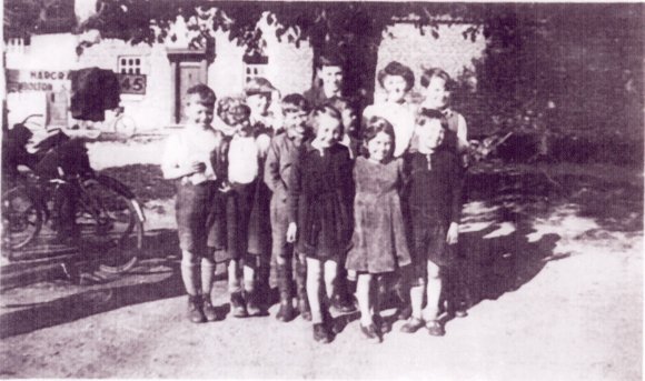 The Village Kids by the Chestnut Tree.

Back (L-R) Kenny Allan, Keith Hudson, Margaret Chapman & Douglas Saddington.

Middle (L-R) Richard Burton, Horace Eady, George Smith & Bobby Allan.

Front (L-R) Marion Felce, Beryl Salmon & Clifford Saddington.